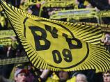 BVB: Fan trägt Klubfahne auf das Dach Europas
