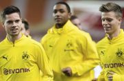 Dzenis Burnic (rechts) vom Bundesligisten Borussia Dortmund läuft sich gemeinsam mit Julian Weigl (links) und Abdou Diallo (Mitte) warm.