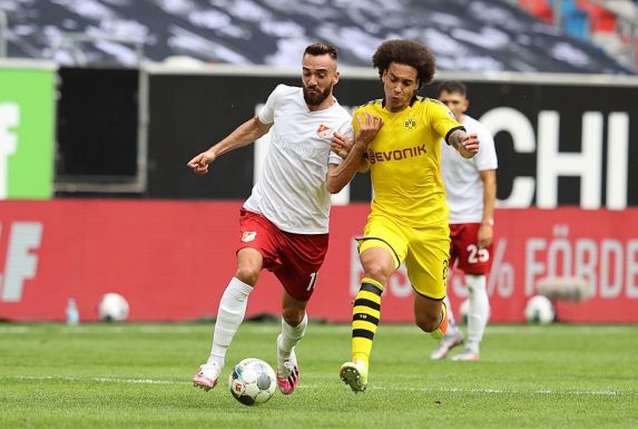 Düsseldorfs Kenan Karaman im Zweikampf mit Axel Witsel von Borussia Dortmund.